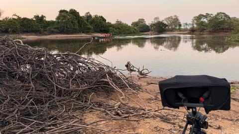 A microphone in front of a lake